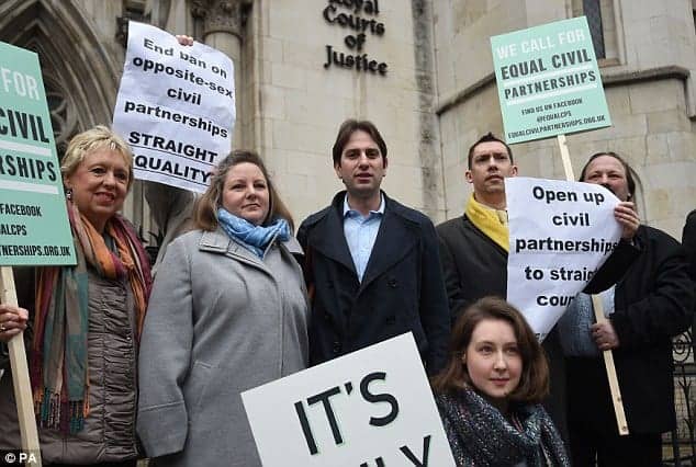 Rebecca Steinfeld and Charles Keidan stand in front of a court