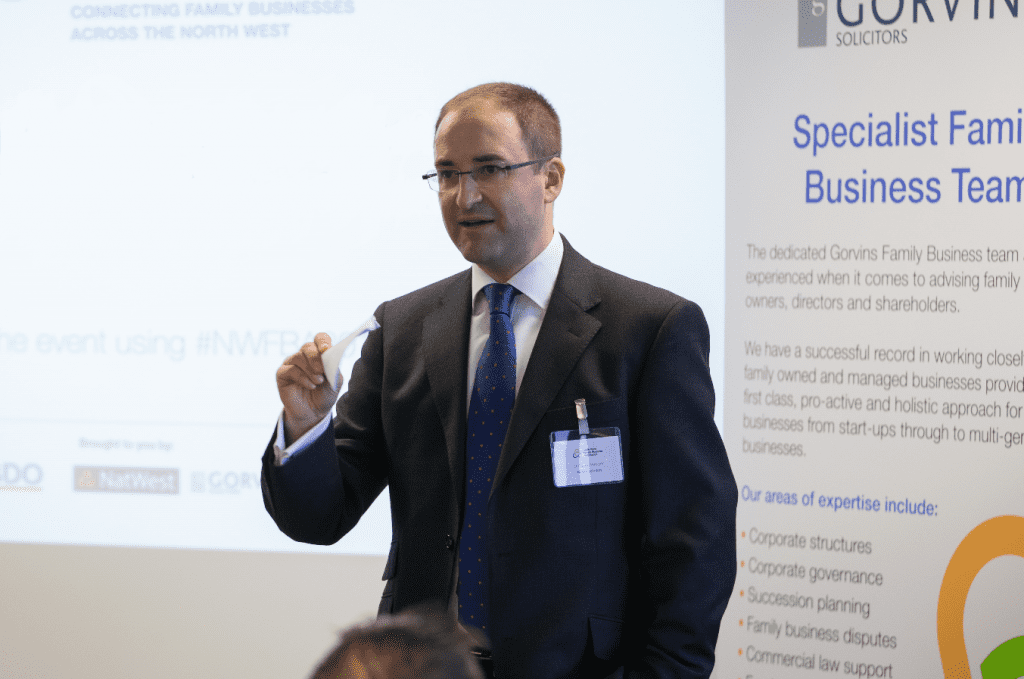 Man making presentation in front of a room of people