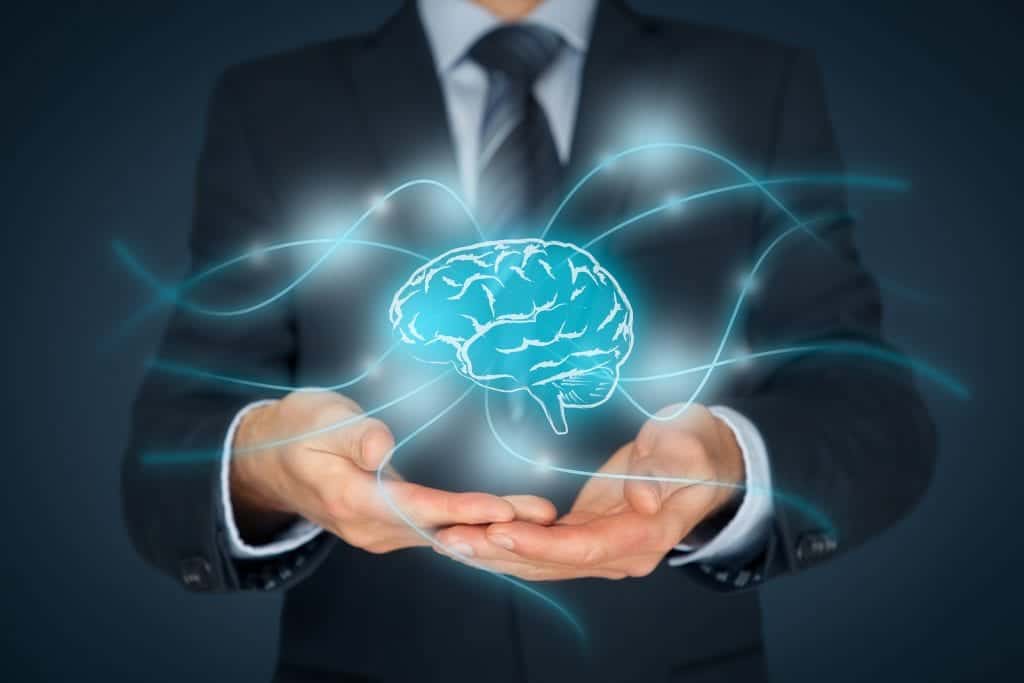 business man holding a hologram of a brain