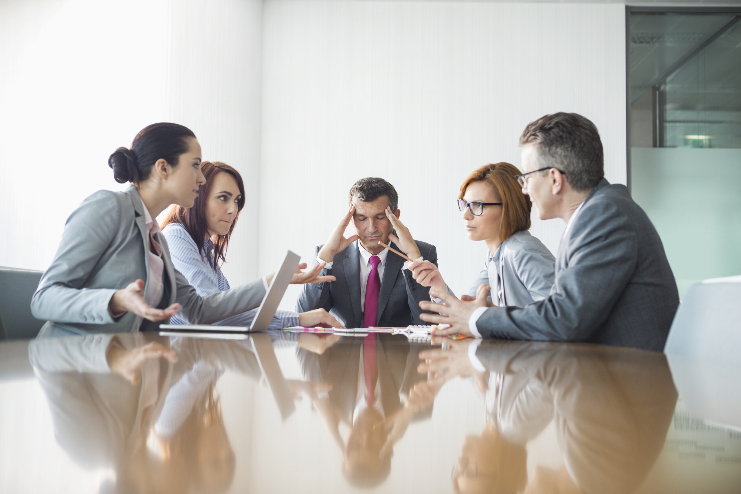 Businesspeople arguing in meeting