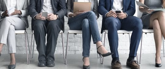 5 of our employment solicitors sat in a row of chairs